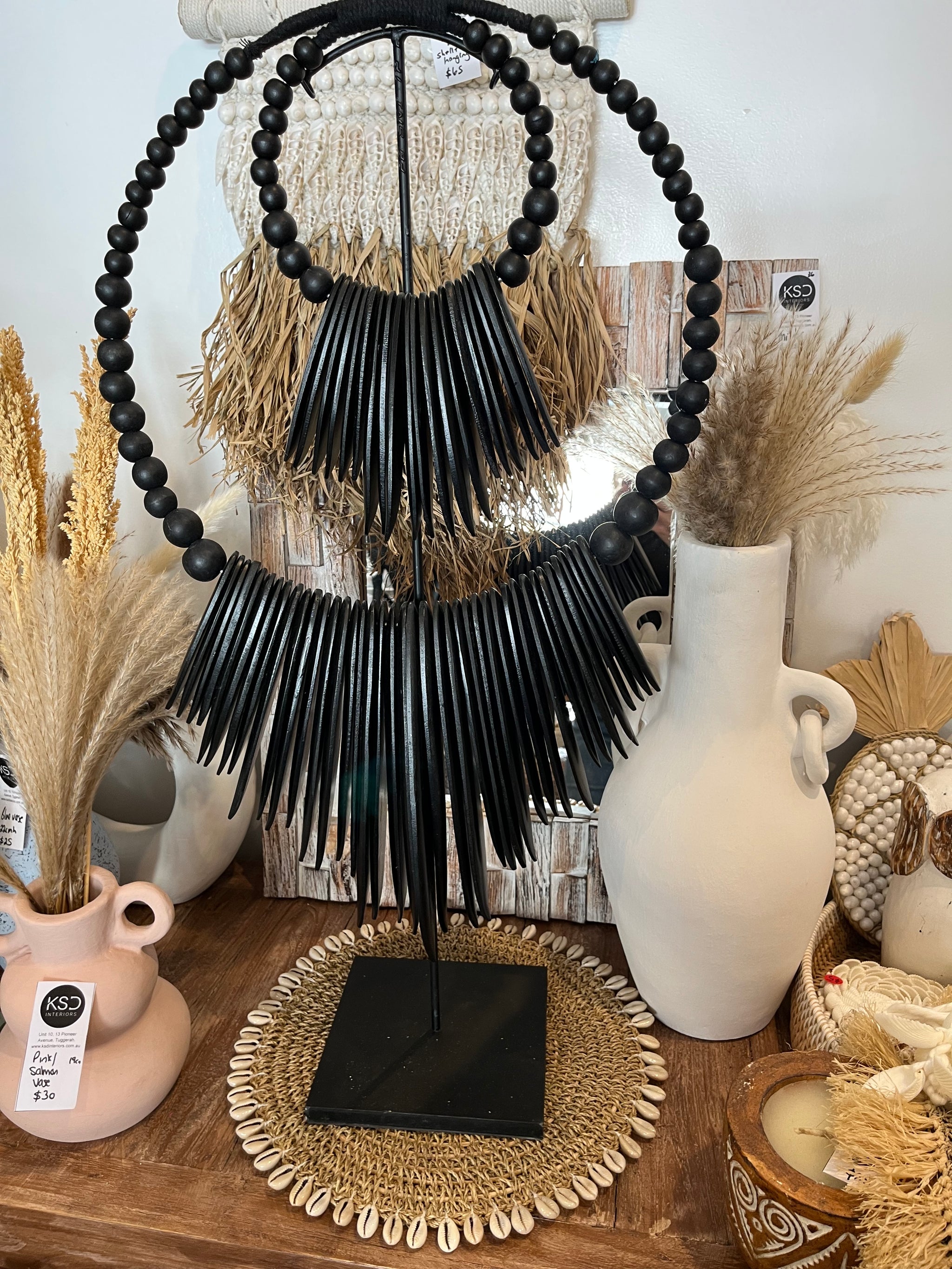 Black timber decoration on stand - Bali Beach Beyond