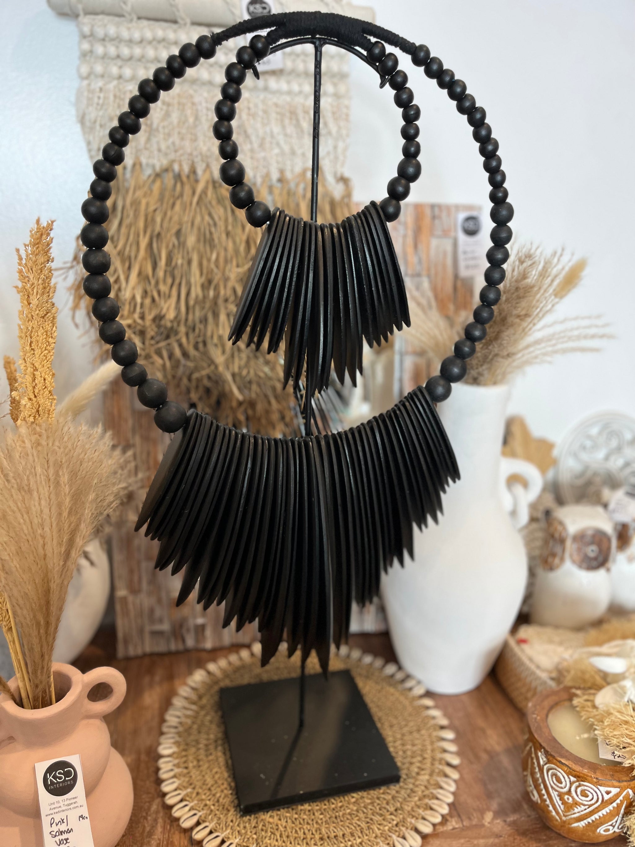 Black timber decoration on stand - Bali Beach Beyond