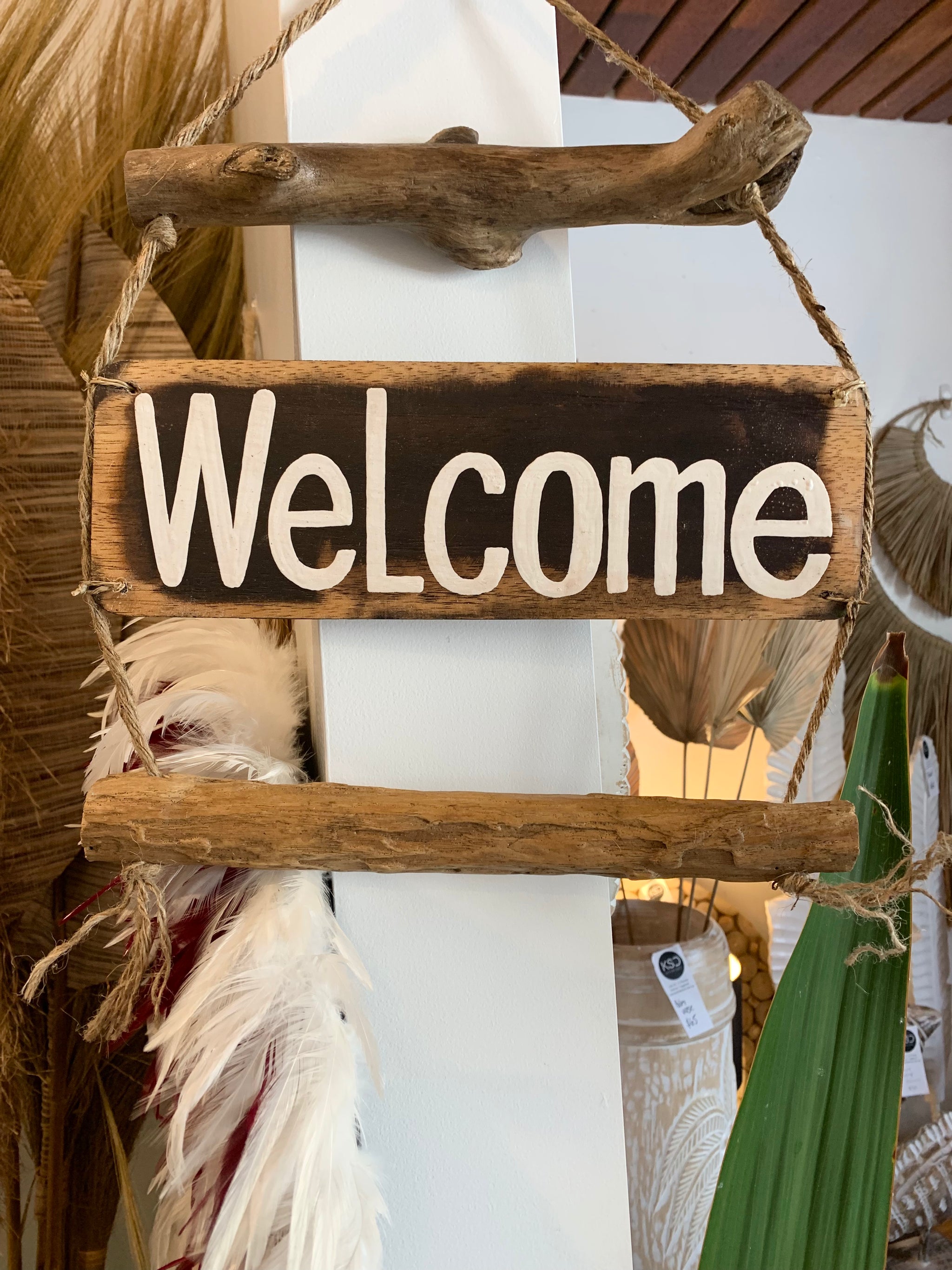 Welcome timber hanging sign. - Bali Beach Beyond