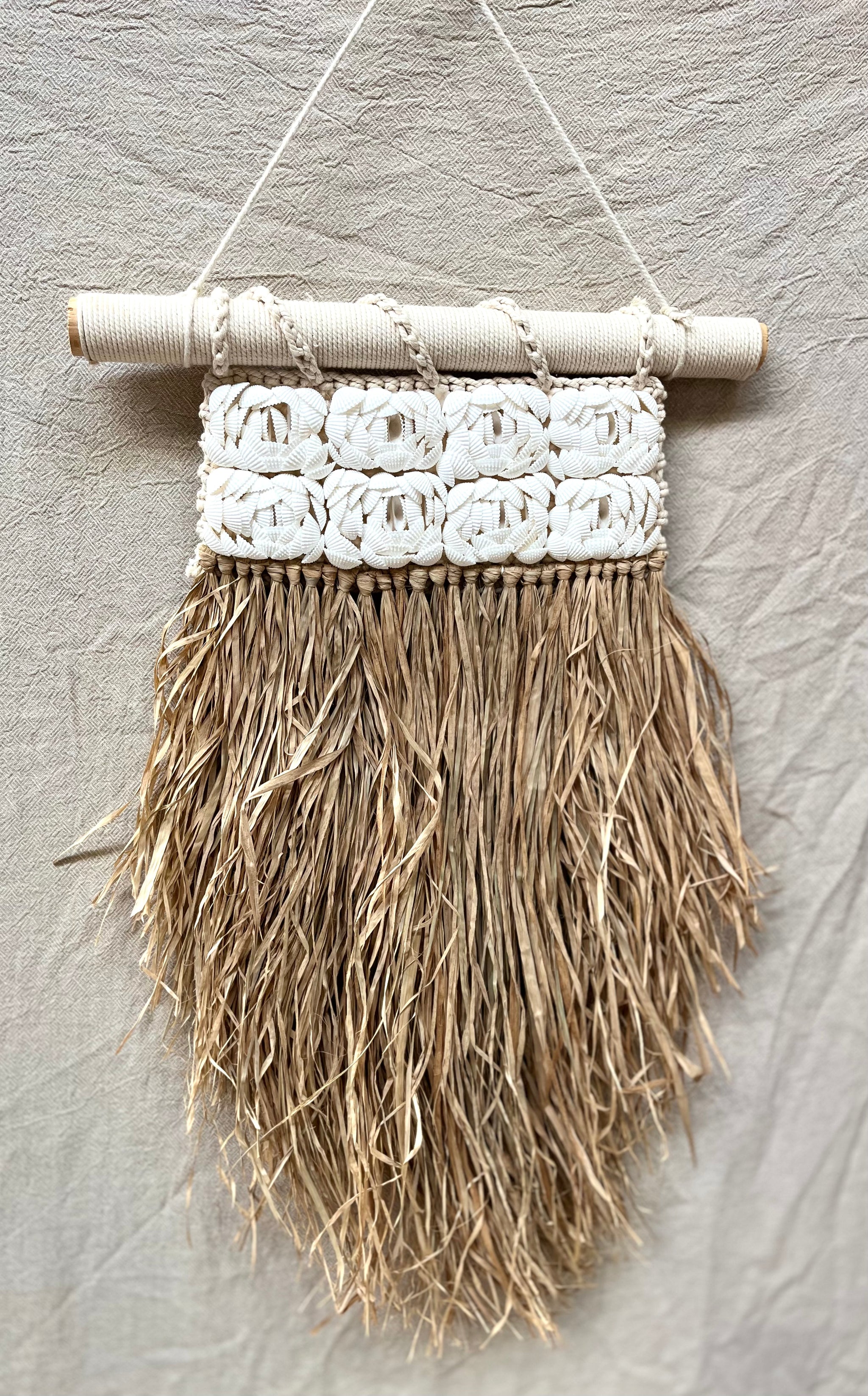 Shell and raffia wall hanging. - Bali Beach Beyond