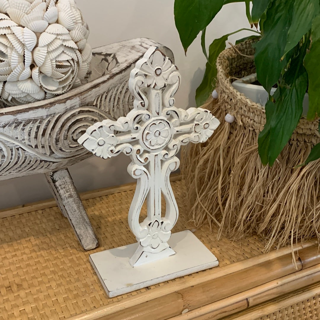White carved cross on stand. - Bali Beach Beyond