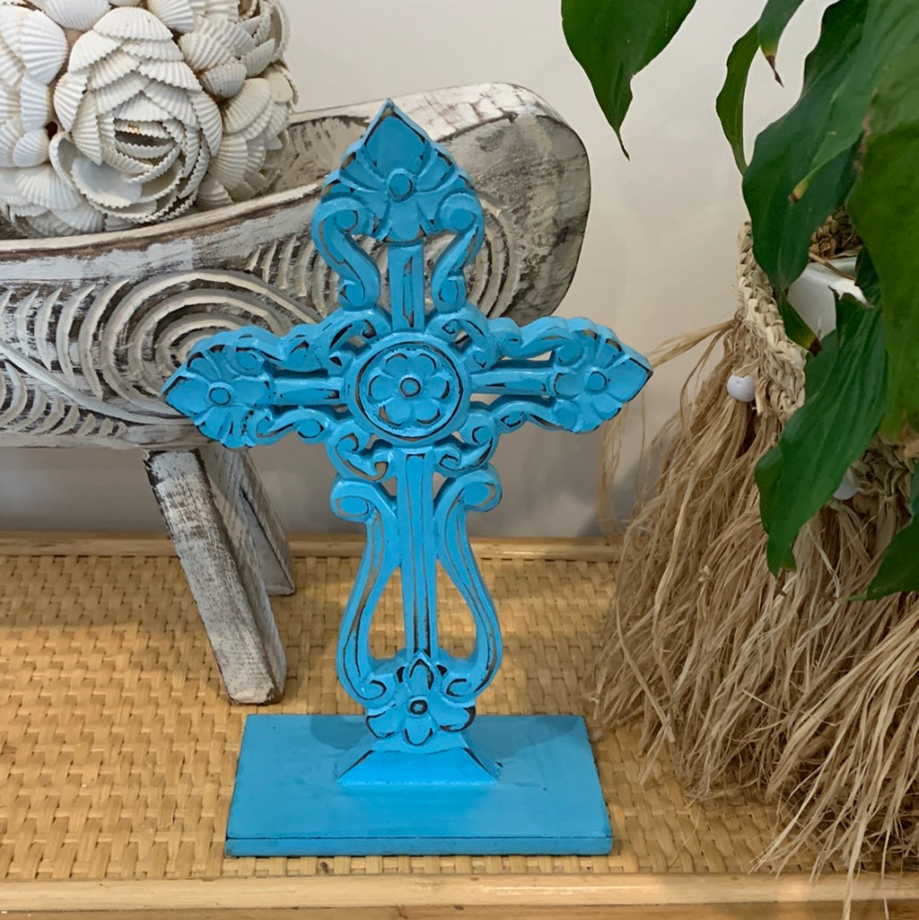 Blue carved cross on stand. - Bali Beach Beyond