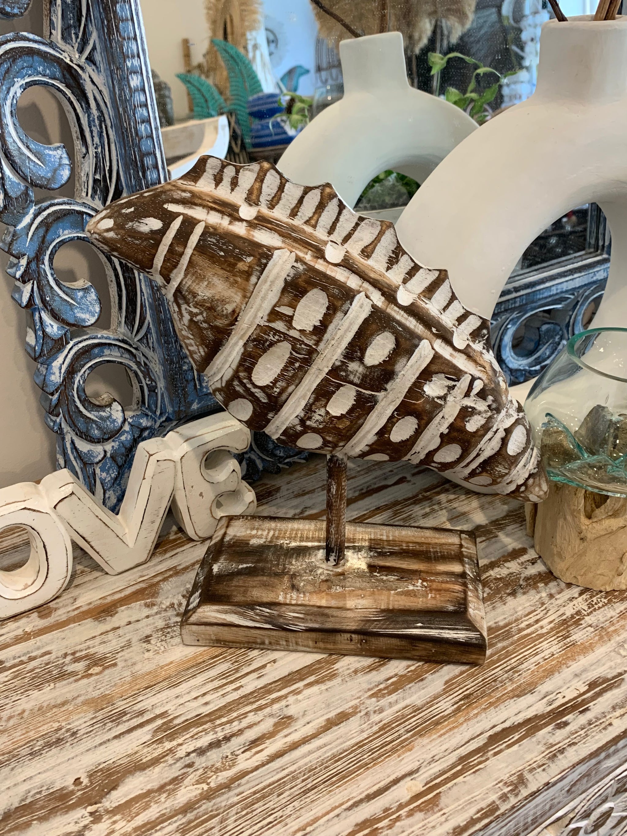 Carved timber shell on stand. Brown. Medium - Bali Beach Beyond