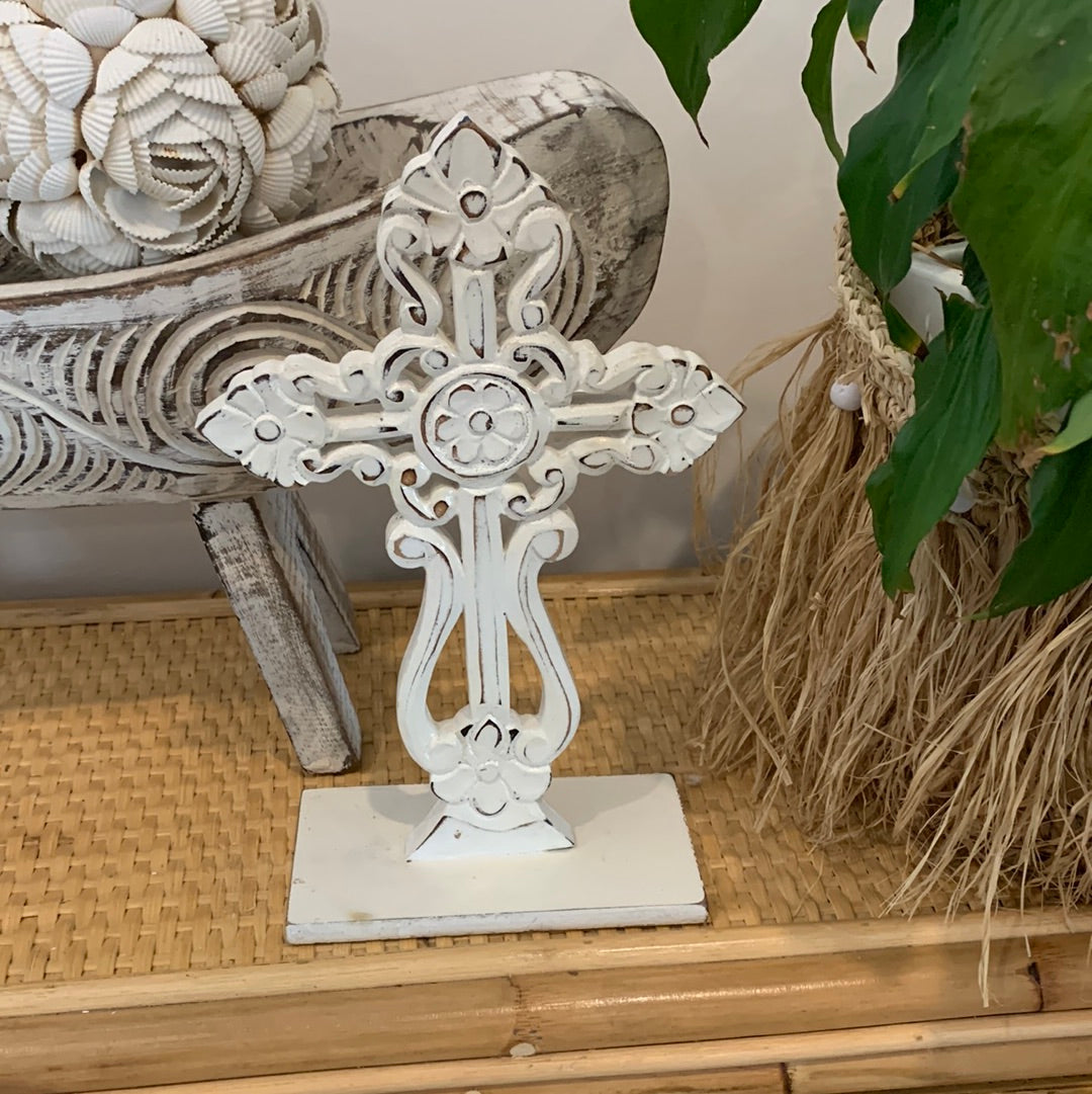 White carved cross on stand. - Bali Beach Beyond