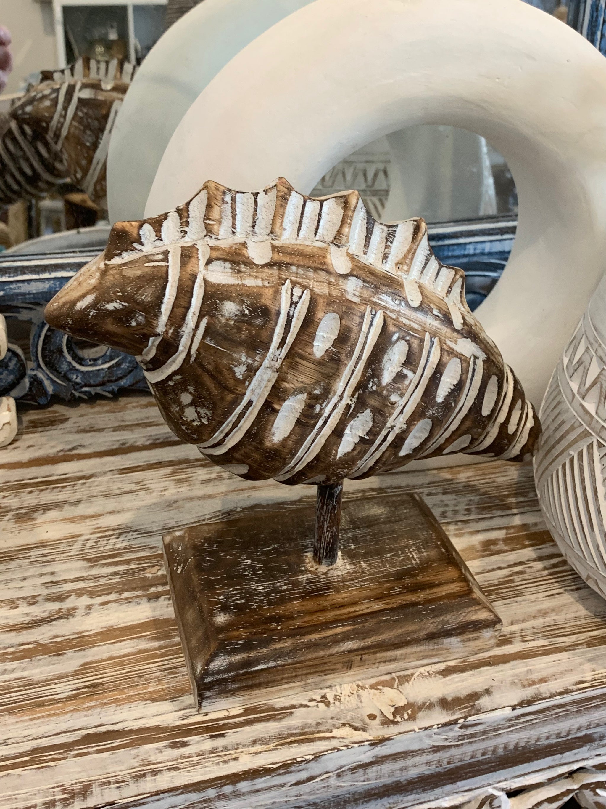 Carved timber shell on stand. Brown. Small - Bali Beach Beyond