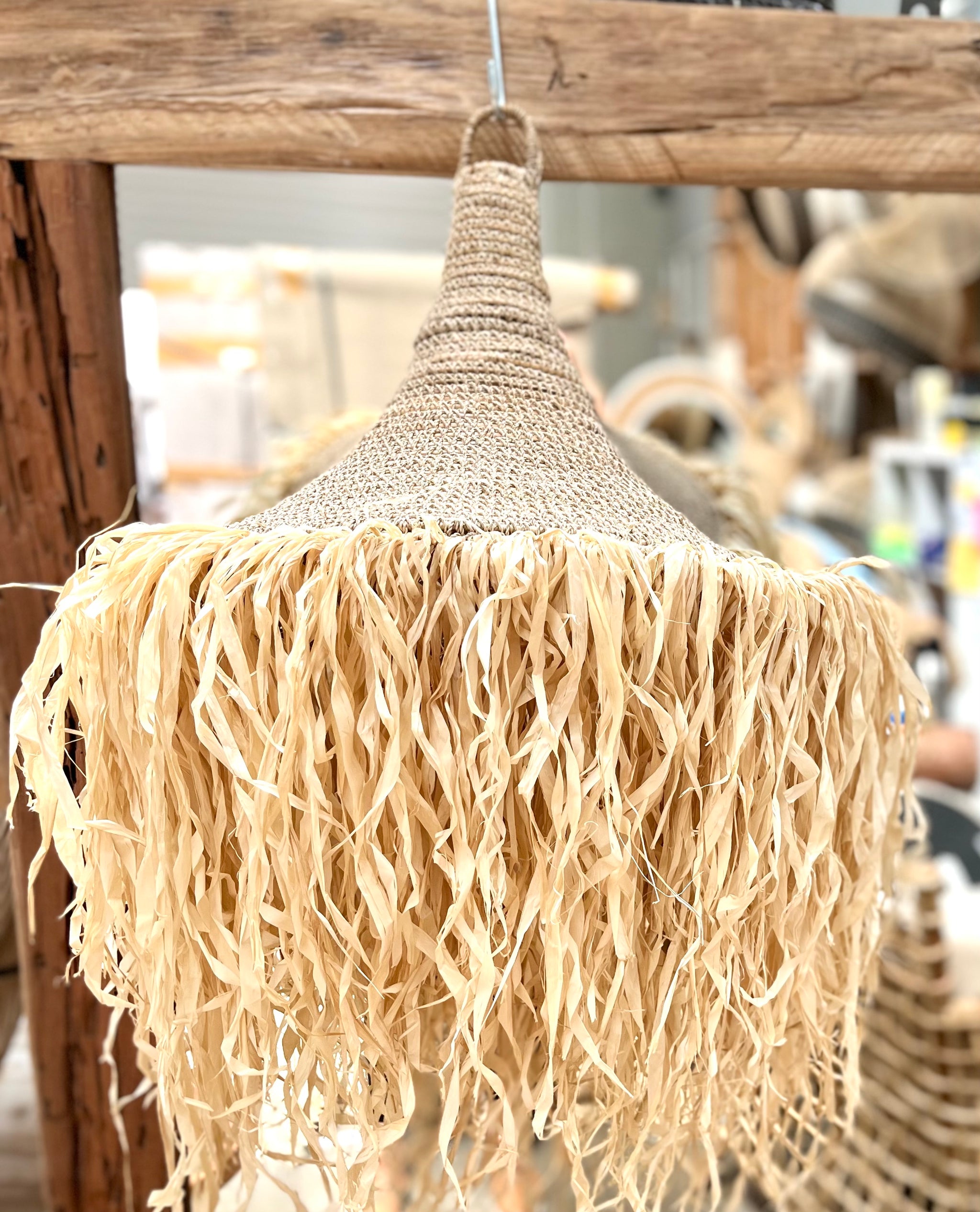 Woven light pendant with raffia