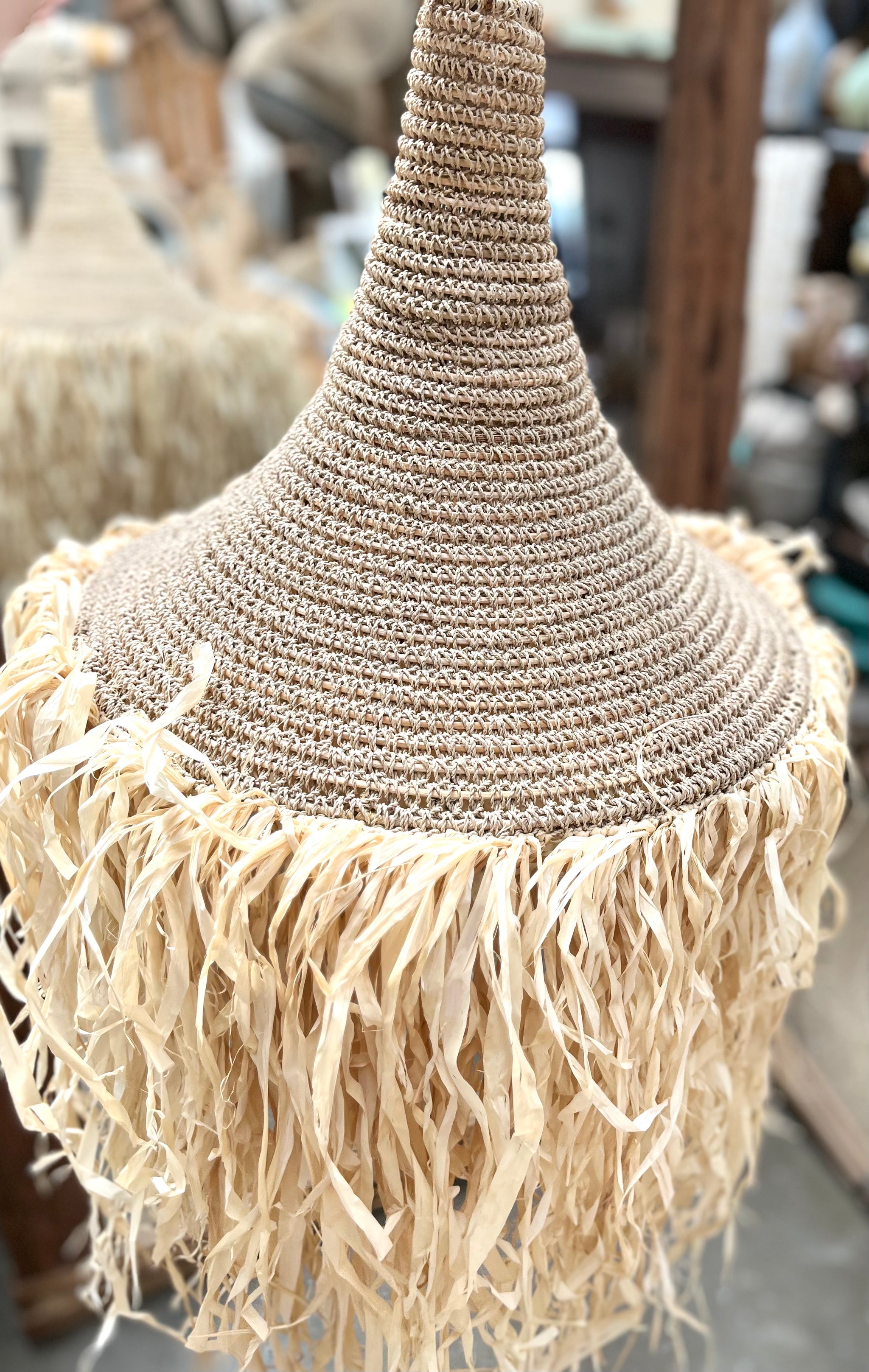 Woven light pendant with raffia