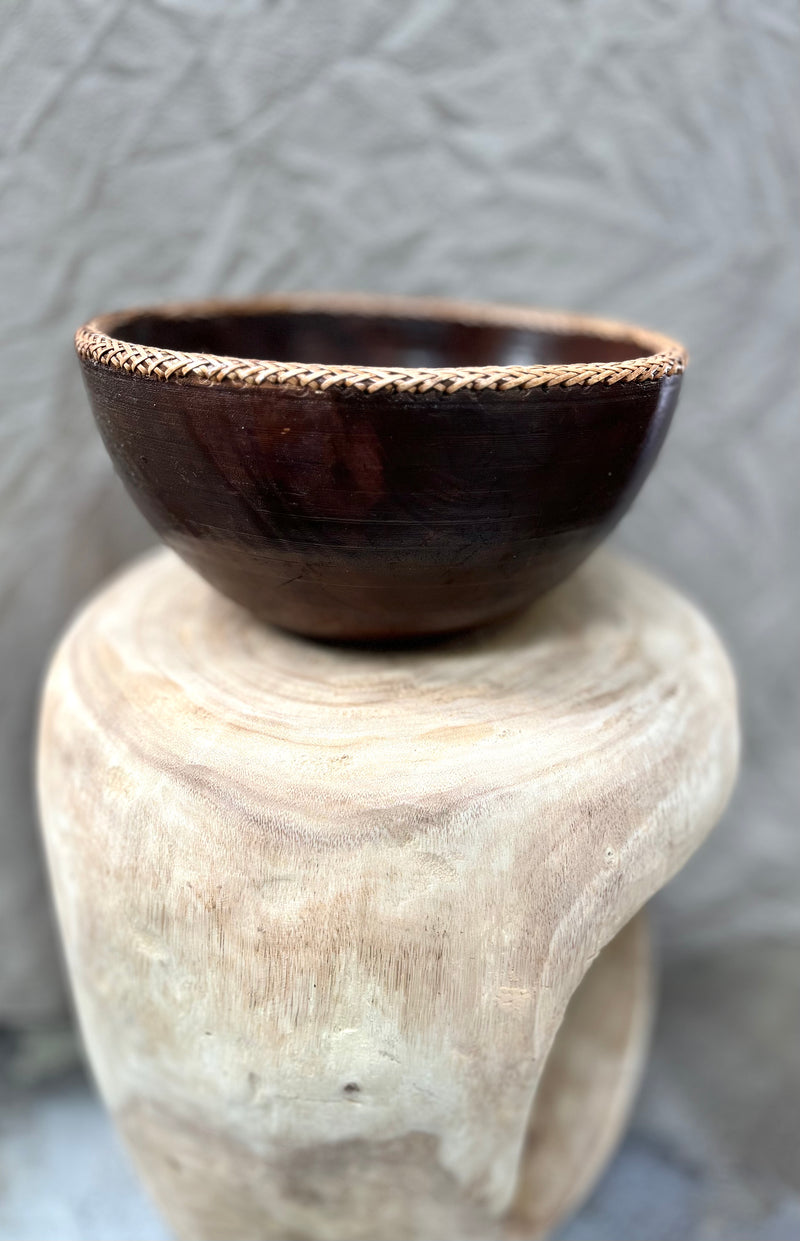 Brown timber bowl with rattan edge detail. L