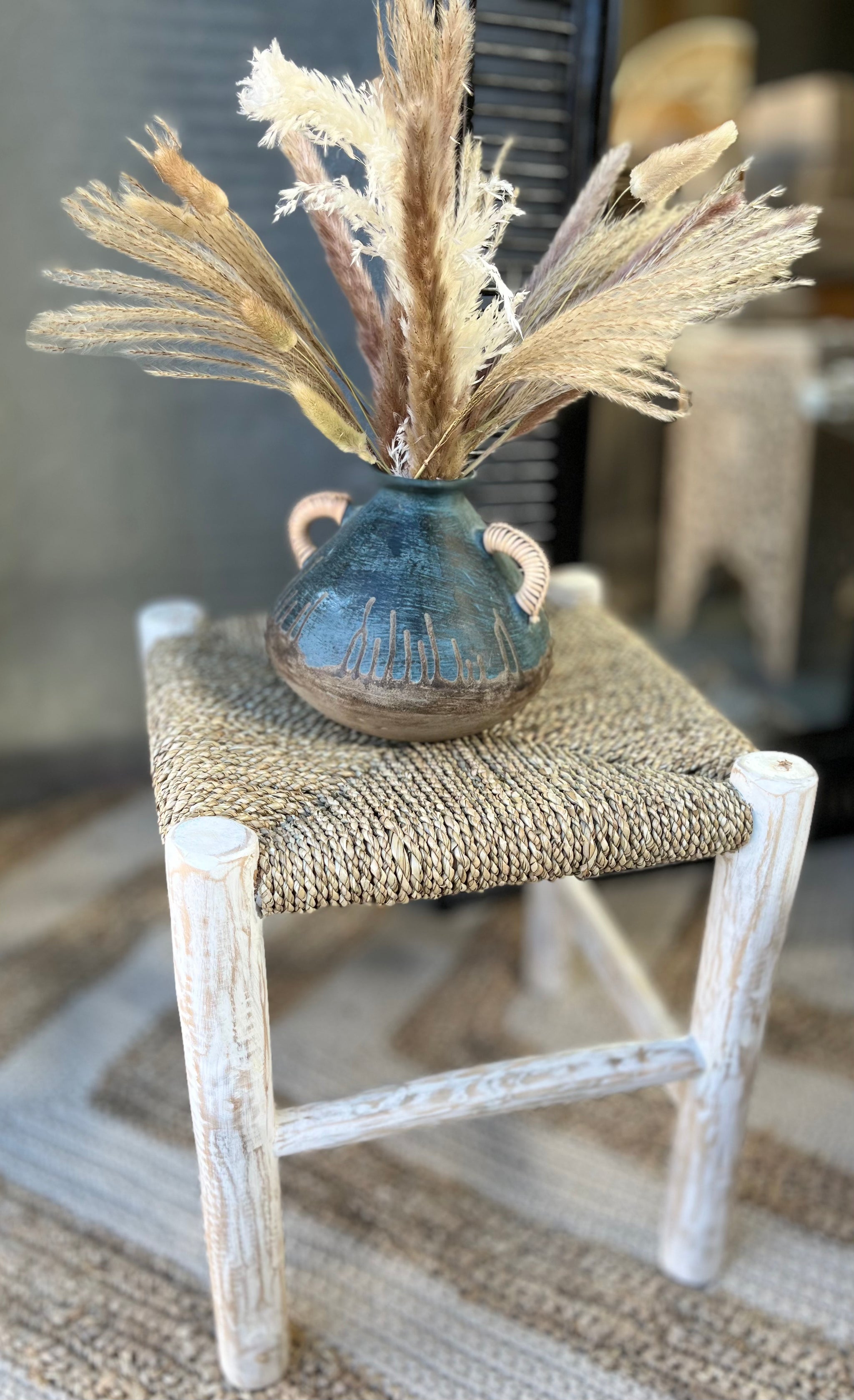 Blue terracotta vase with rattan handles