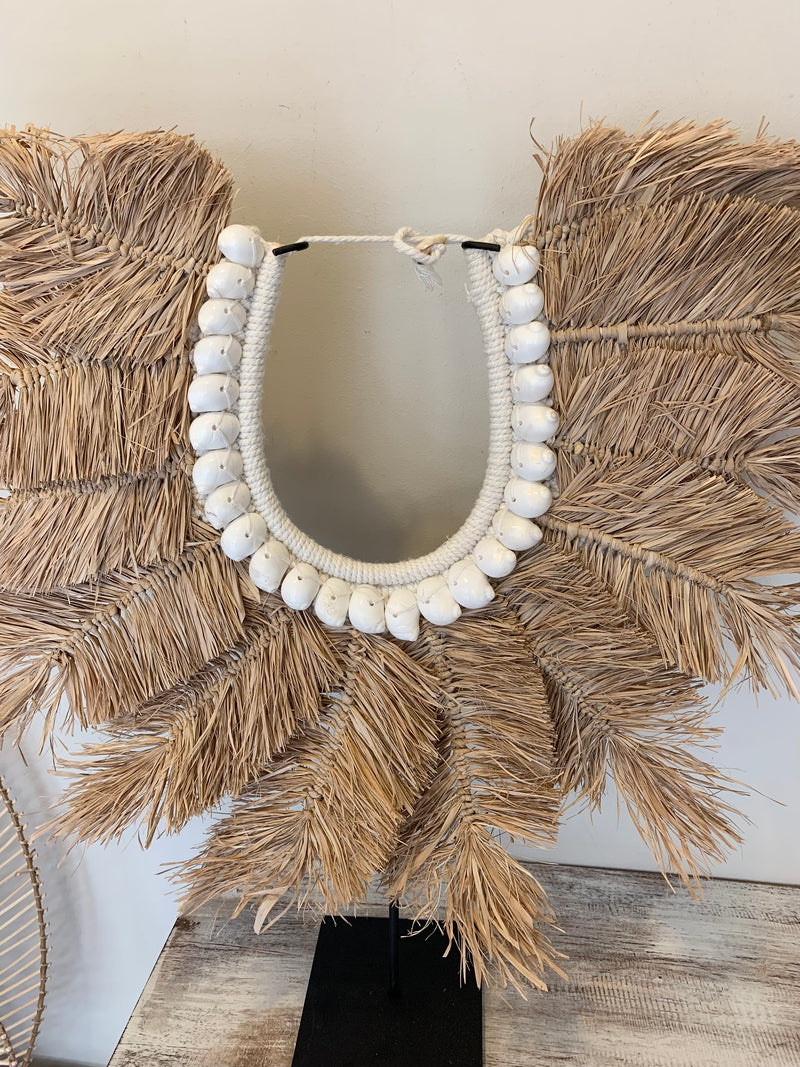 Raffia feather decoration on stand