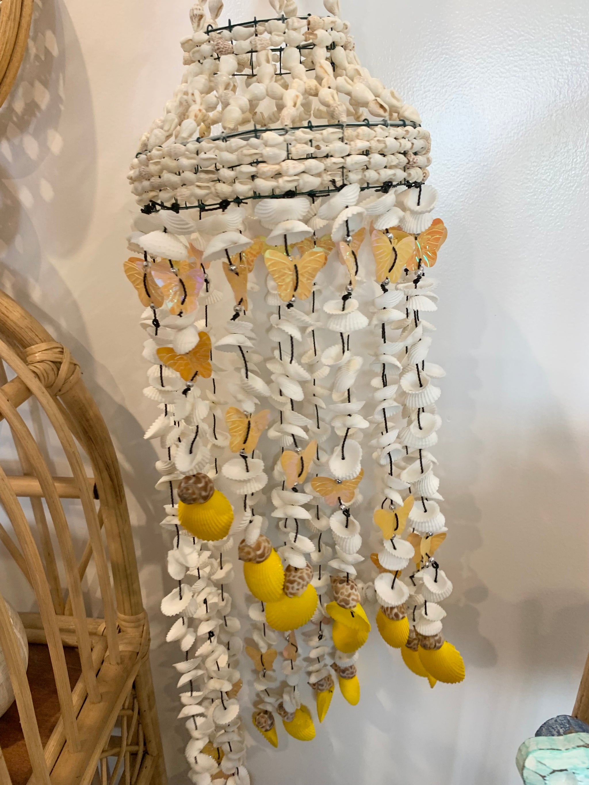 Yellow butterfly and shell mobile hanging