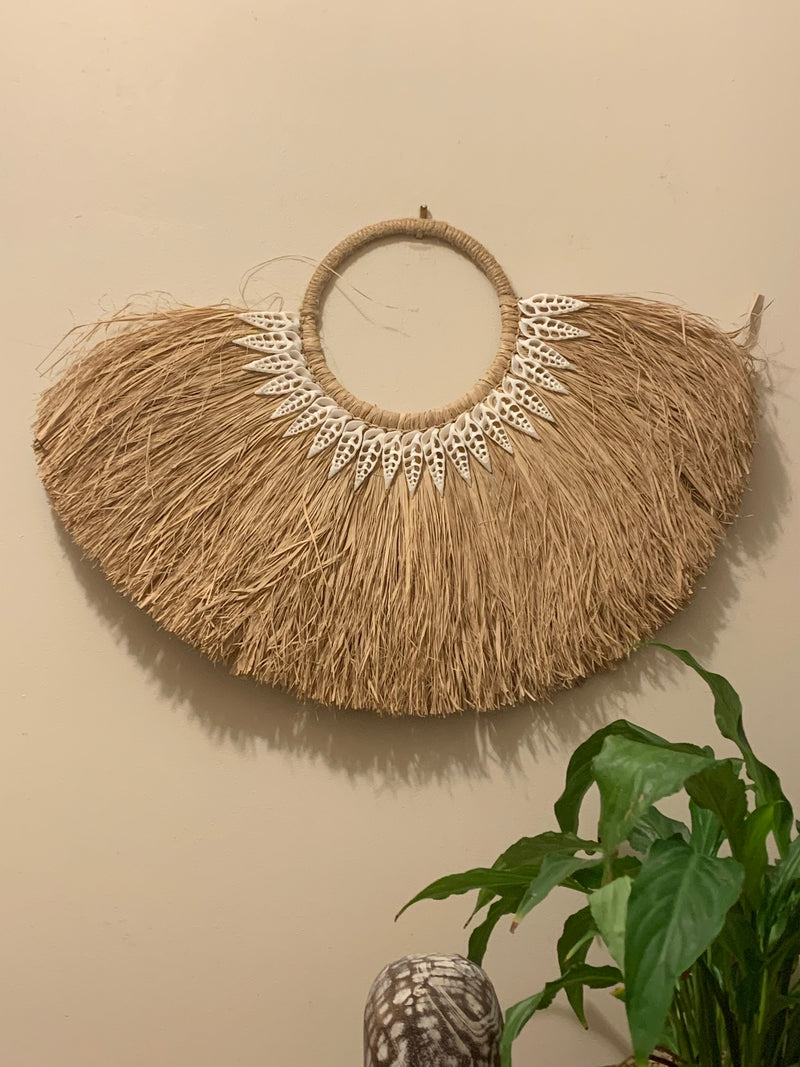 Wall hanging with white shells