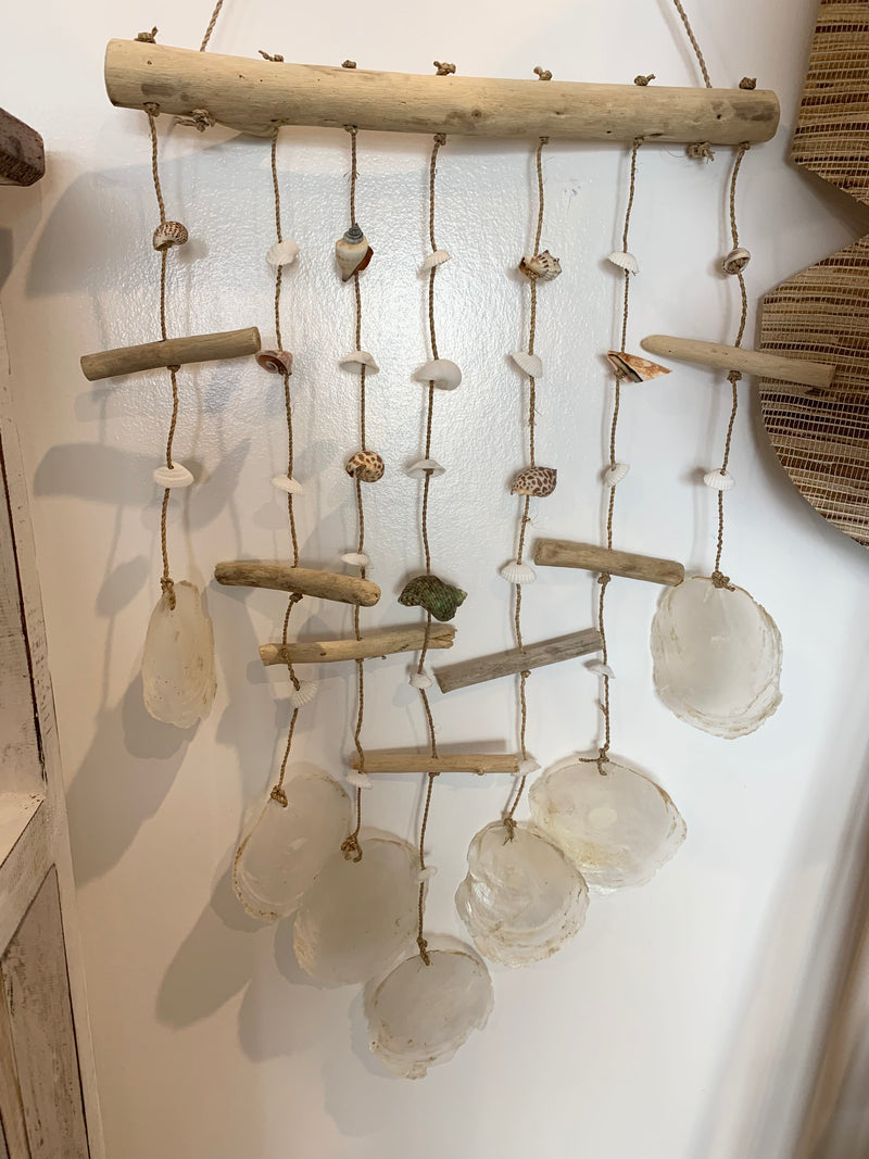 Shell wall hanging on timber stick