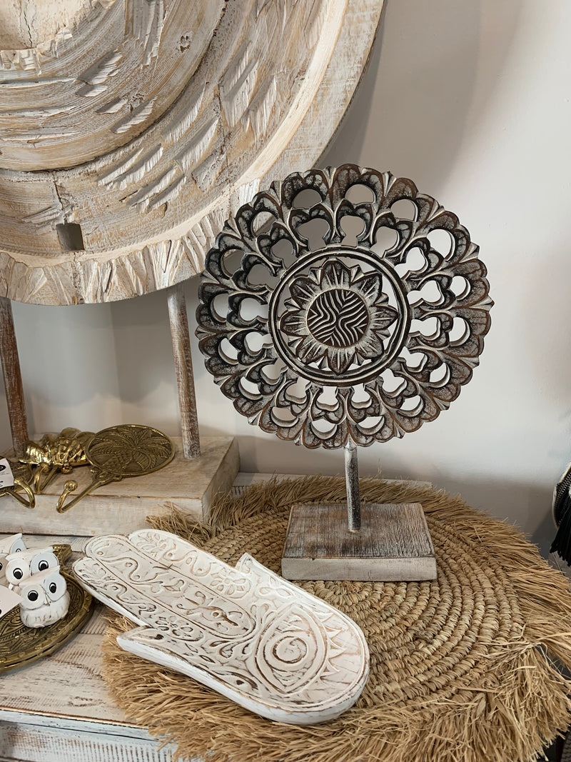 Handcarved decorative flower/ coin on stand. Brown. L