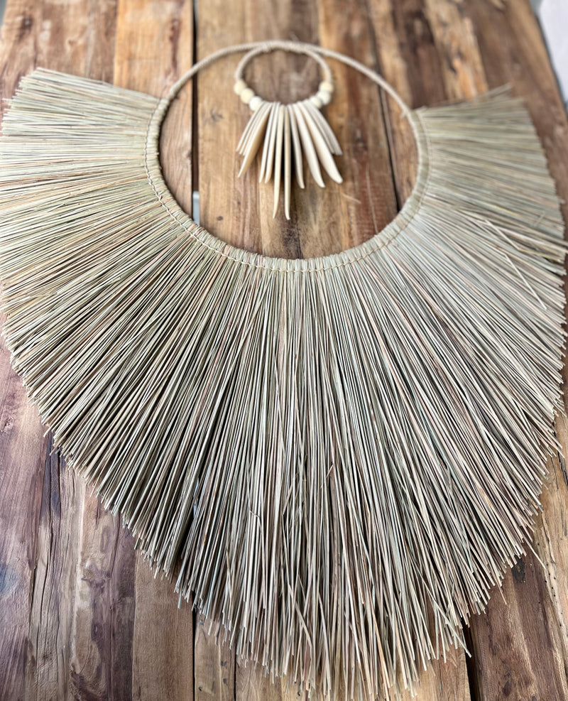 Raffia and natural timber wall hanging