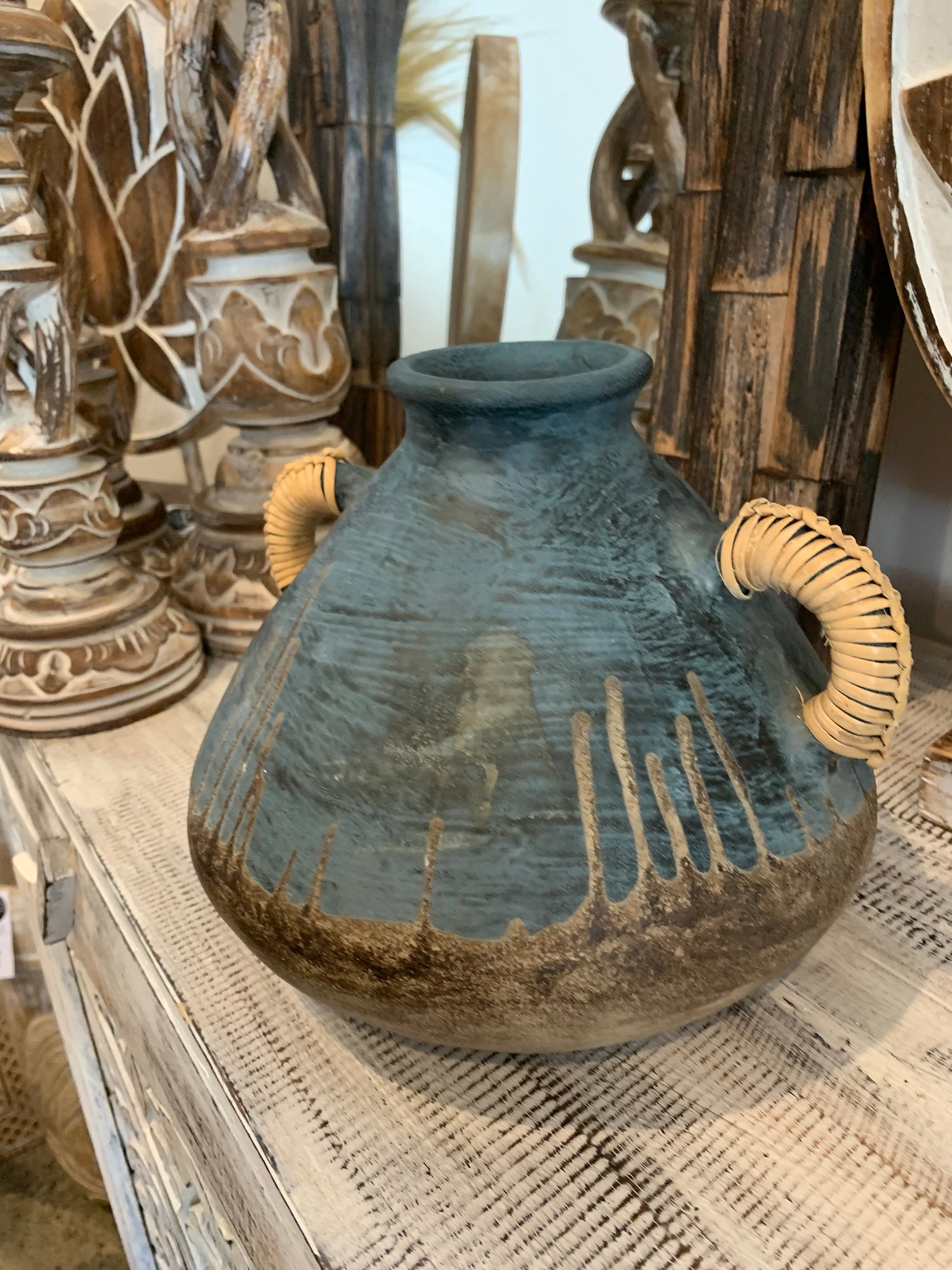 Blue terracotta vase with rattan handles