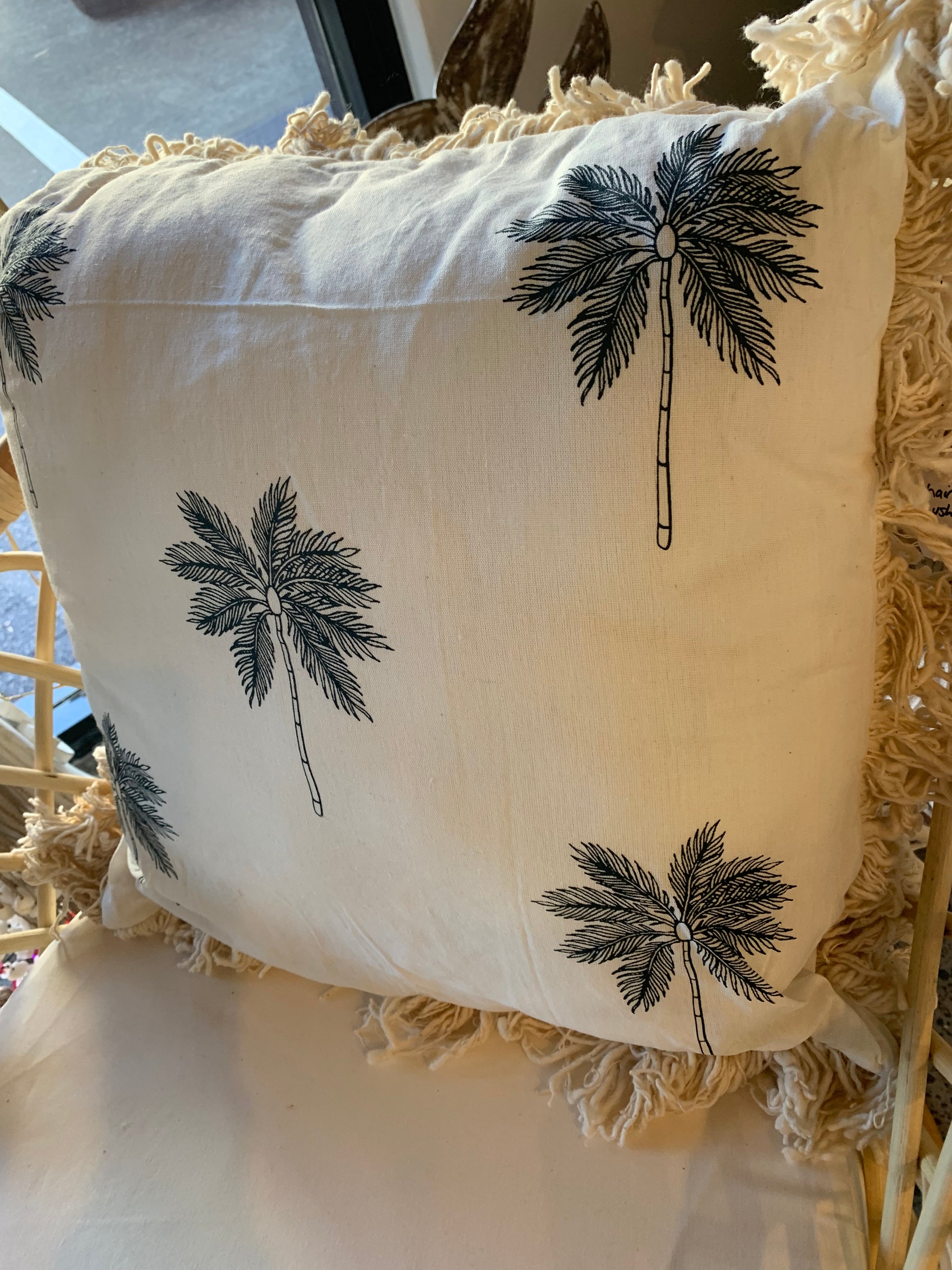 Natural cushion with frill and palm tree design